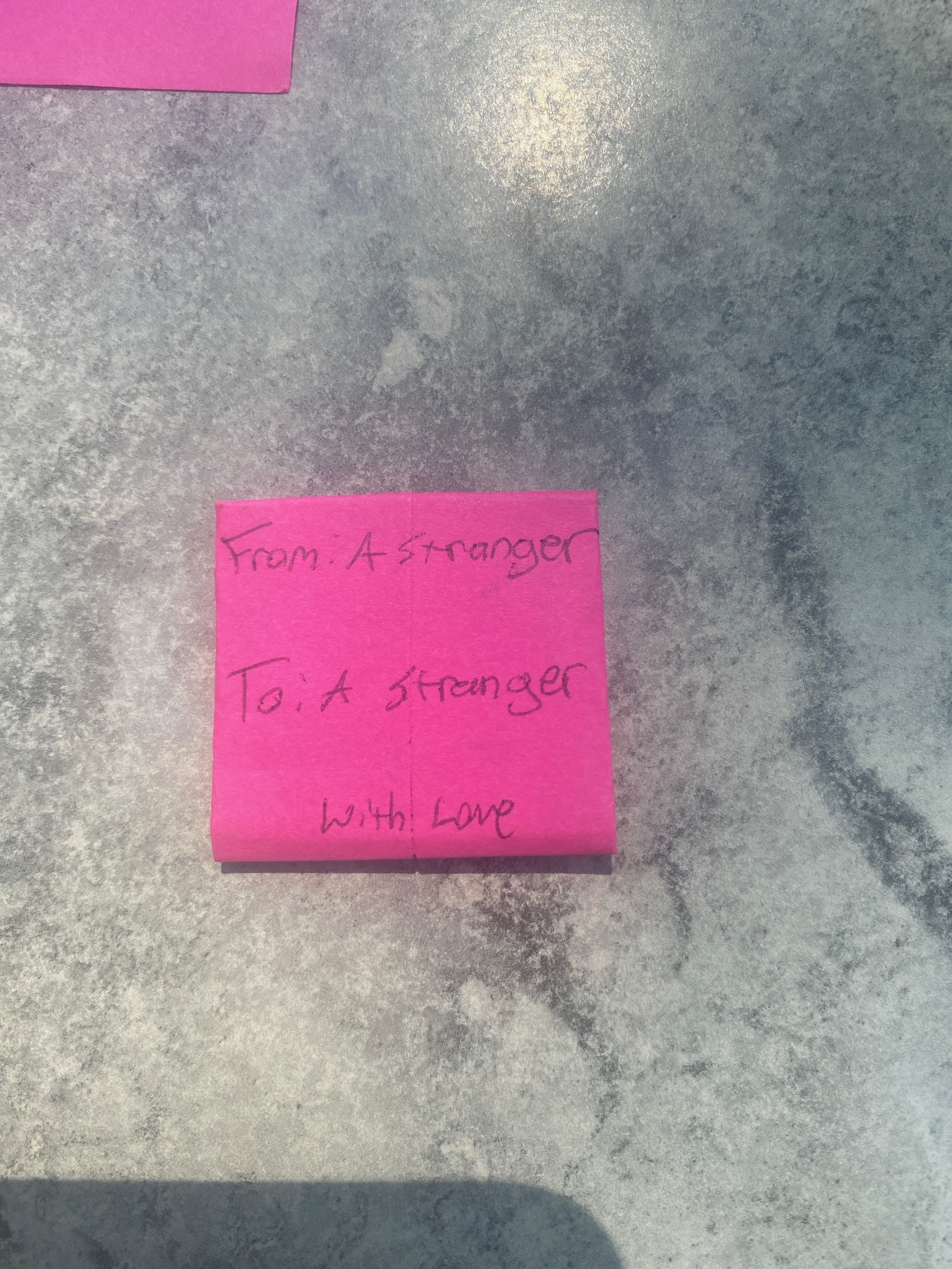 Handwritten notes folded and ready to be left