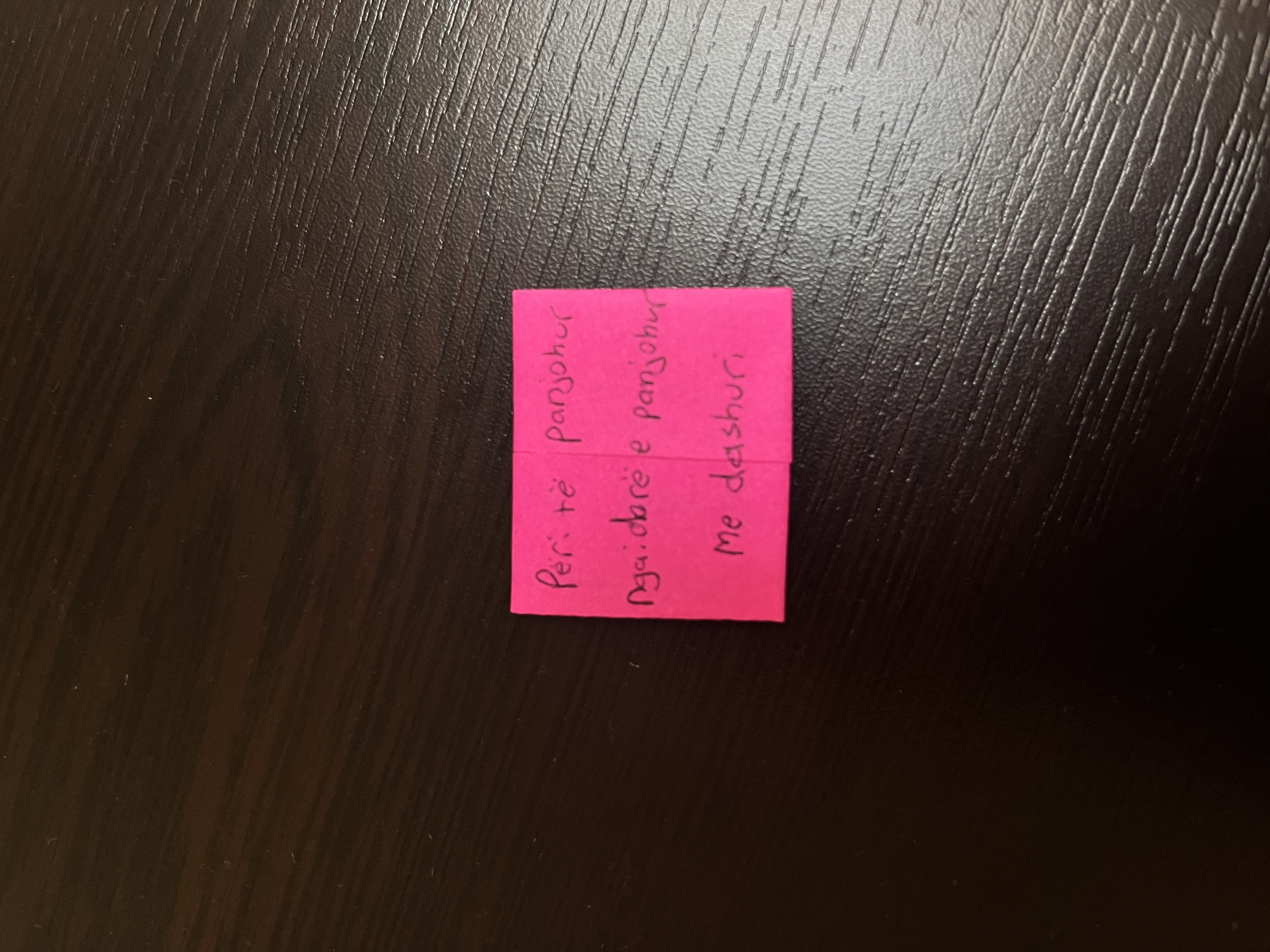 Handwritten notes folded and ready to be left